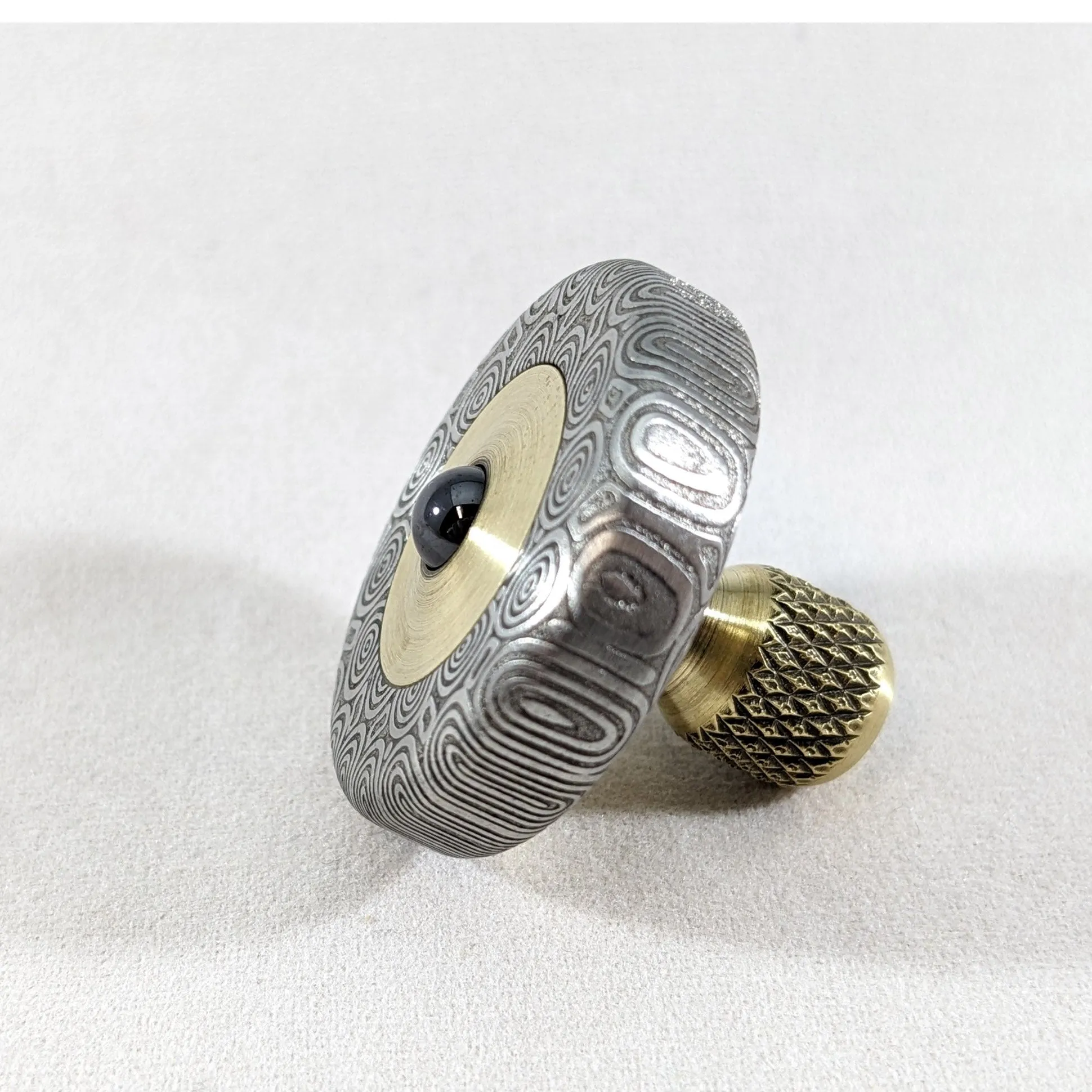 Dynamini - Damasteel and Brass