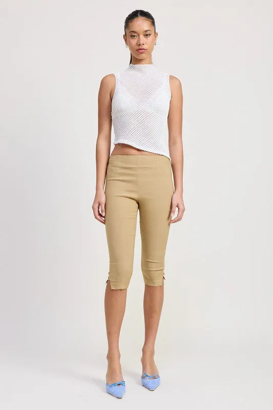 SLEEVELESS ASYMMETRICAL HIGH NECK TOP